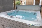 Enjoy the hot tub after the day at the beach. The screen provides privacy.